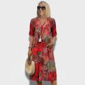Vibrantes Midi-Kleid mit Taschen und Muster – Elara