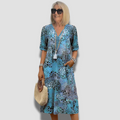 Vibrantes Midi-Kleid mit Taschen und Muster – Elara
